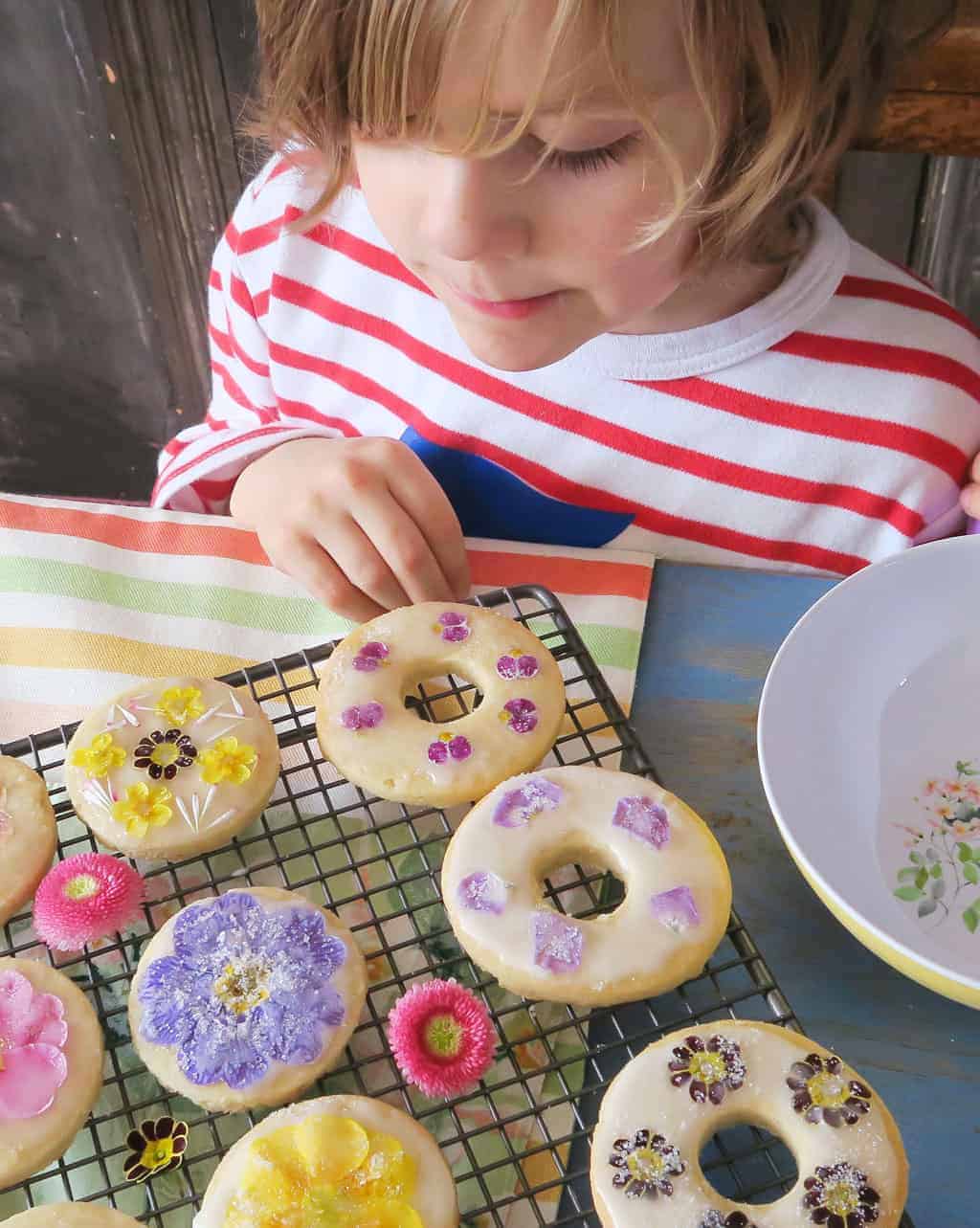 Edible flower biscuits drying on a cooling rack