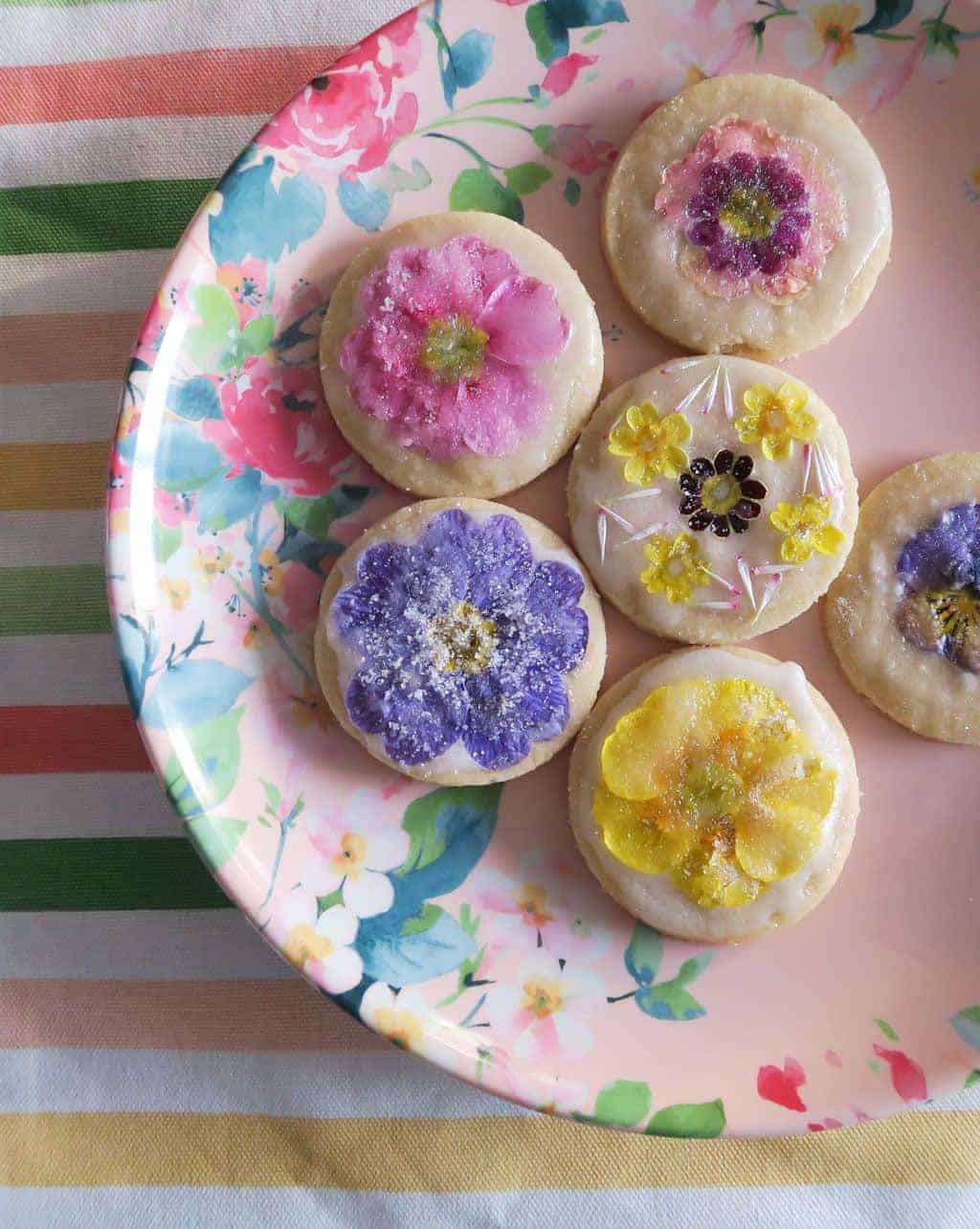 Edible flower biscuits on a floral melamine plate