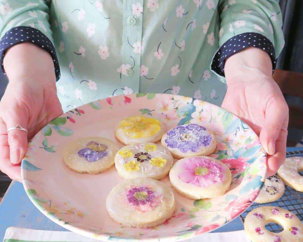 Edible flower biscuits presented on a floral melamine plate by Laura Ashley