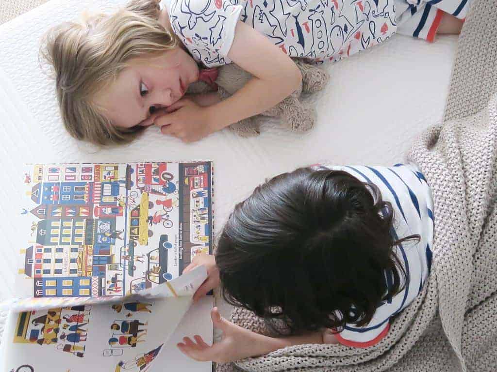 The twins reading a book.