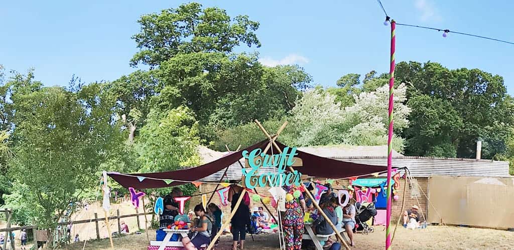 The Craft Corner at Camp Bestival 2018 where we learnt how to make pom poms
