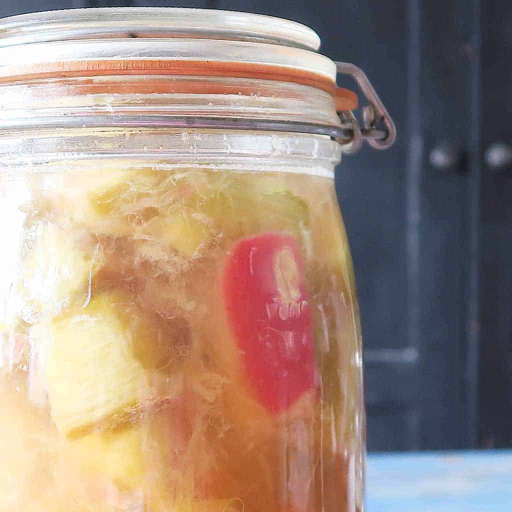 homemade ginger and rhubarb gin in a jar