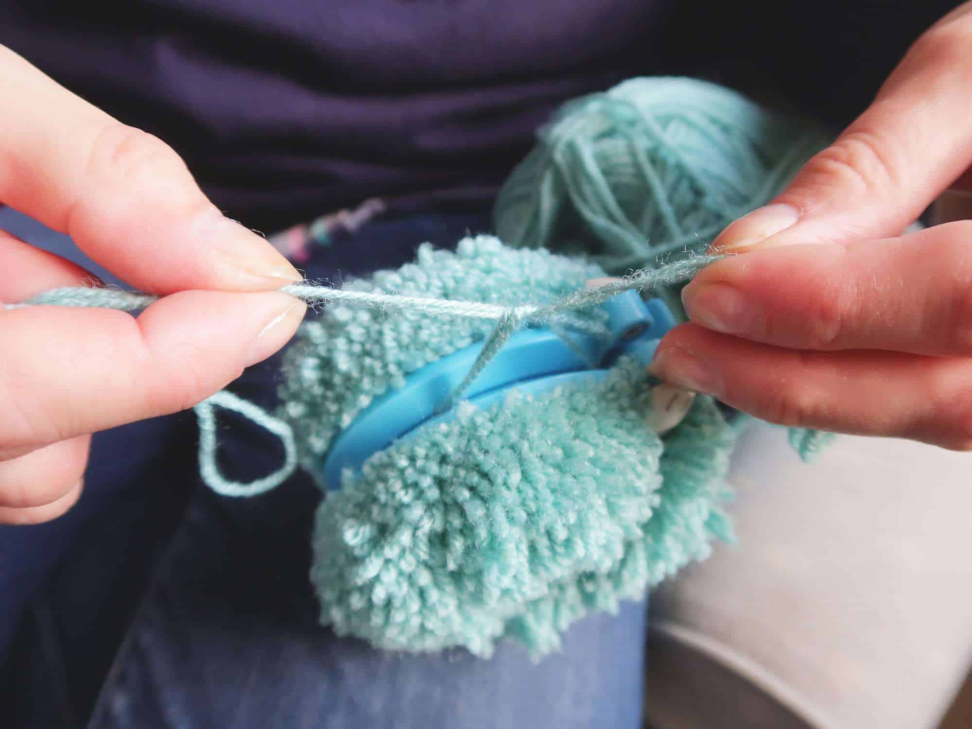 A simple tutorial showing to Make Pom Poms with a pom pom maker