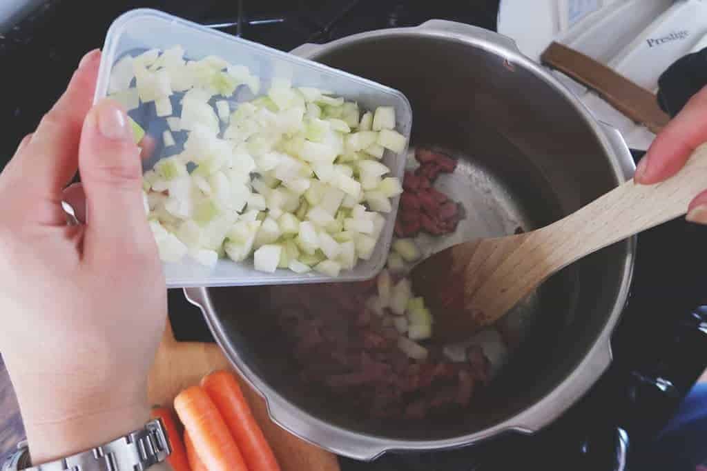 Step two of our quick and easy 15 minute pressure cooker lentil and bacon soup recipe.