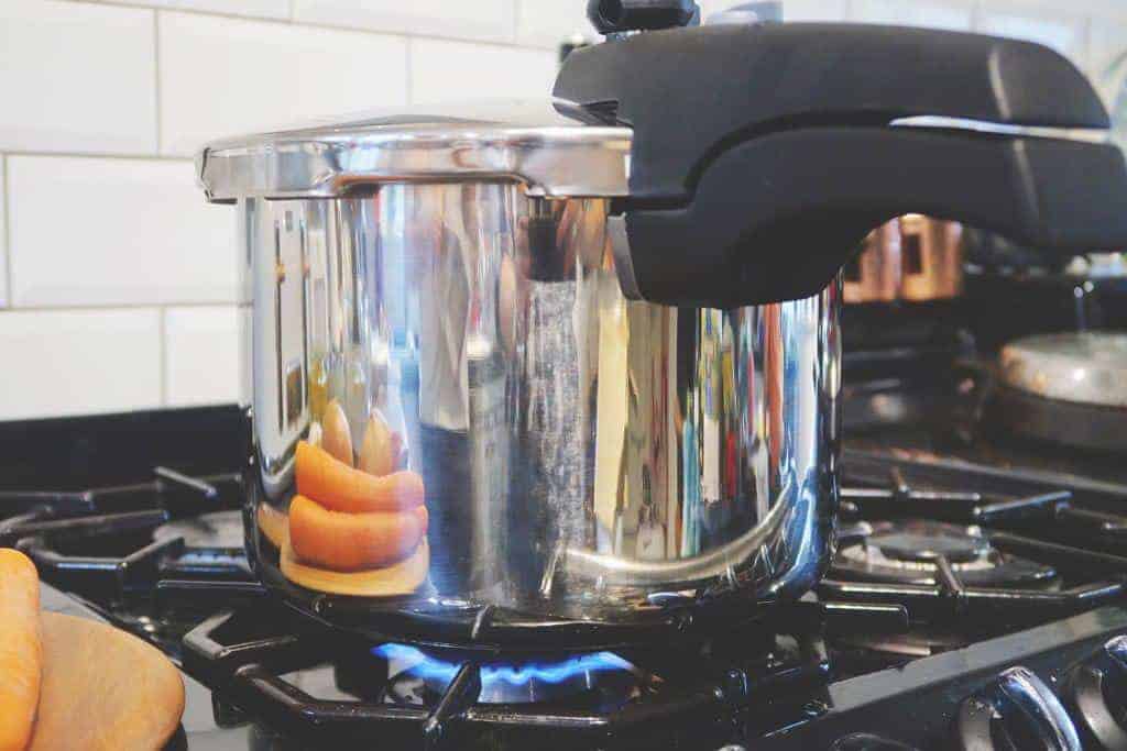 Step five of our quick and easy 15 minute pressure cooker lentil and bacon soup recipe.