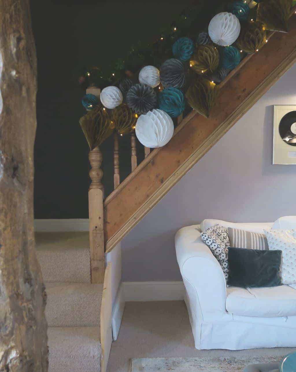 Decorating a Staircase with Honeycomb Balls and paper pom poms