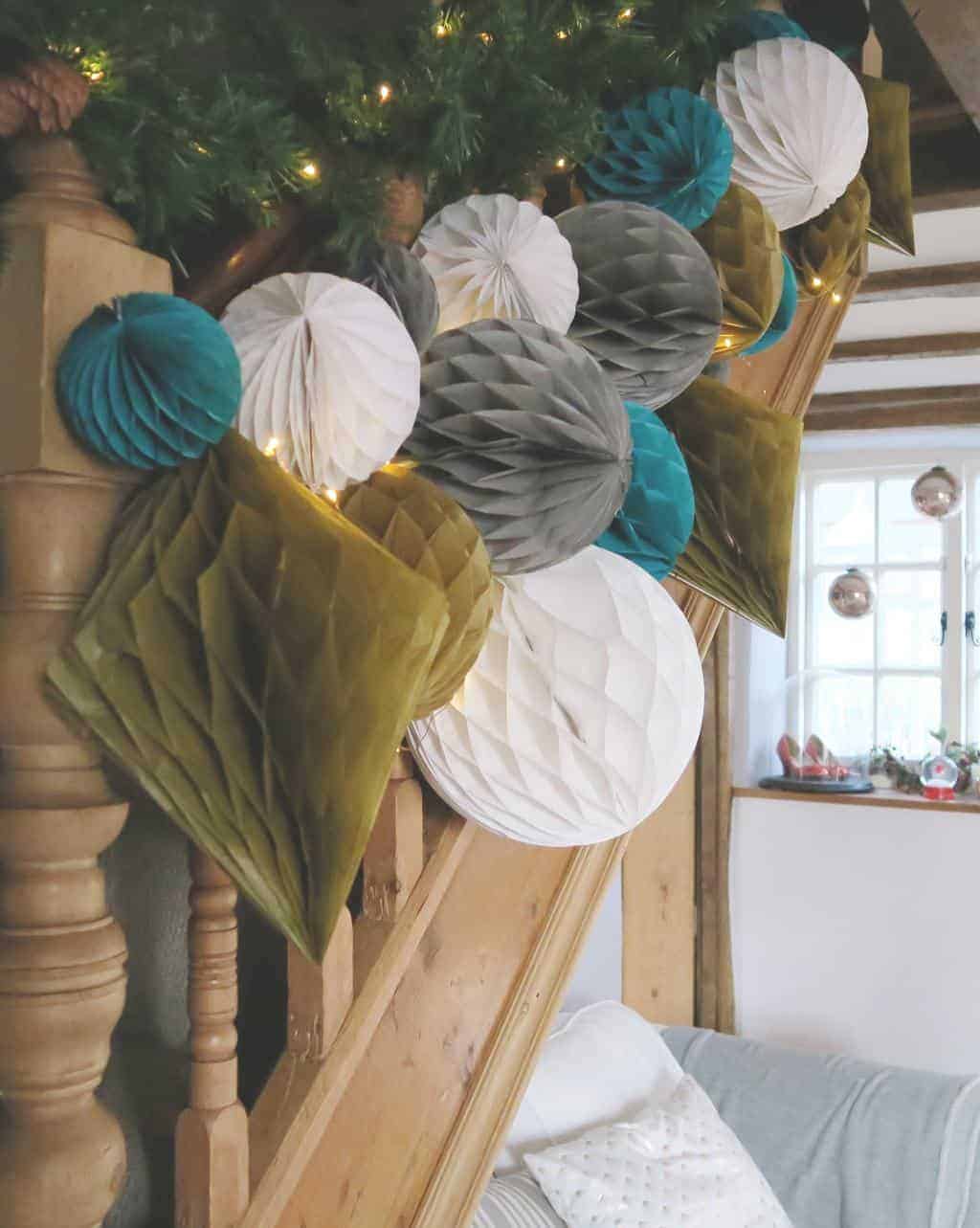 Decorating a Staircase with Honeycomb Balls and paper pom poms