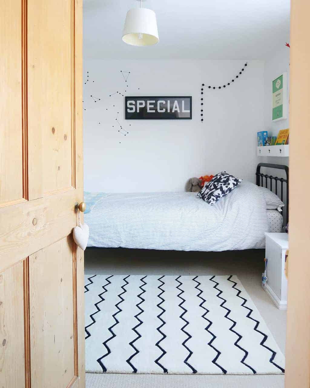 The Listed Home twin bedroom makeover — single black metal dormitory stye bed 