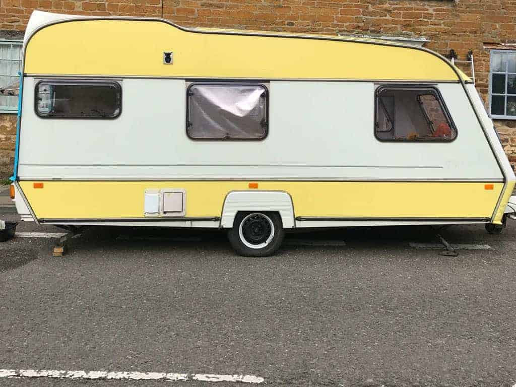 Dolly the yellow and white caravan. Tips for Decorating a Caravan | Painting a Caravan Exterior