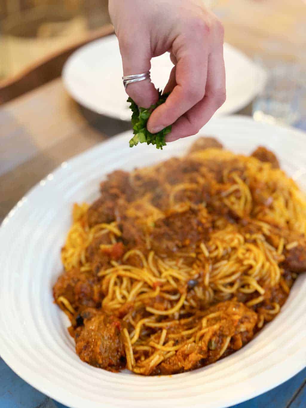 A recipe for homemade Italian Pasta Puttanesca with meatballs.