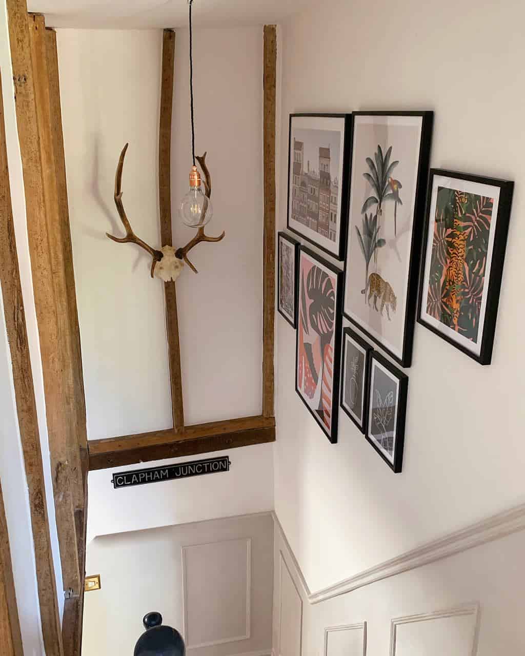 creating a gallery wall and fitting the faux panelling has totally transformed our stairwell