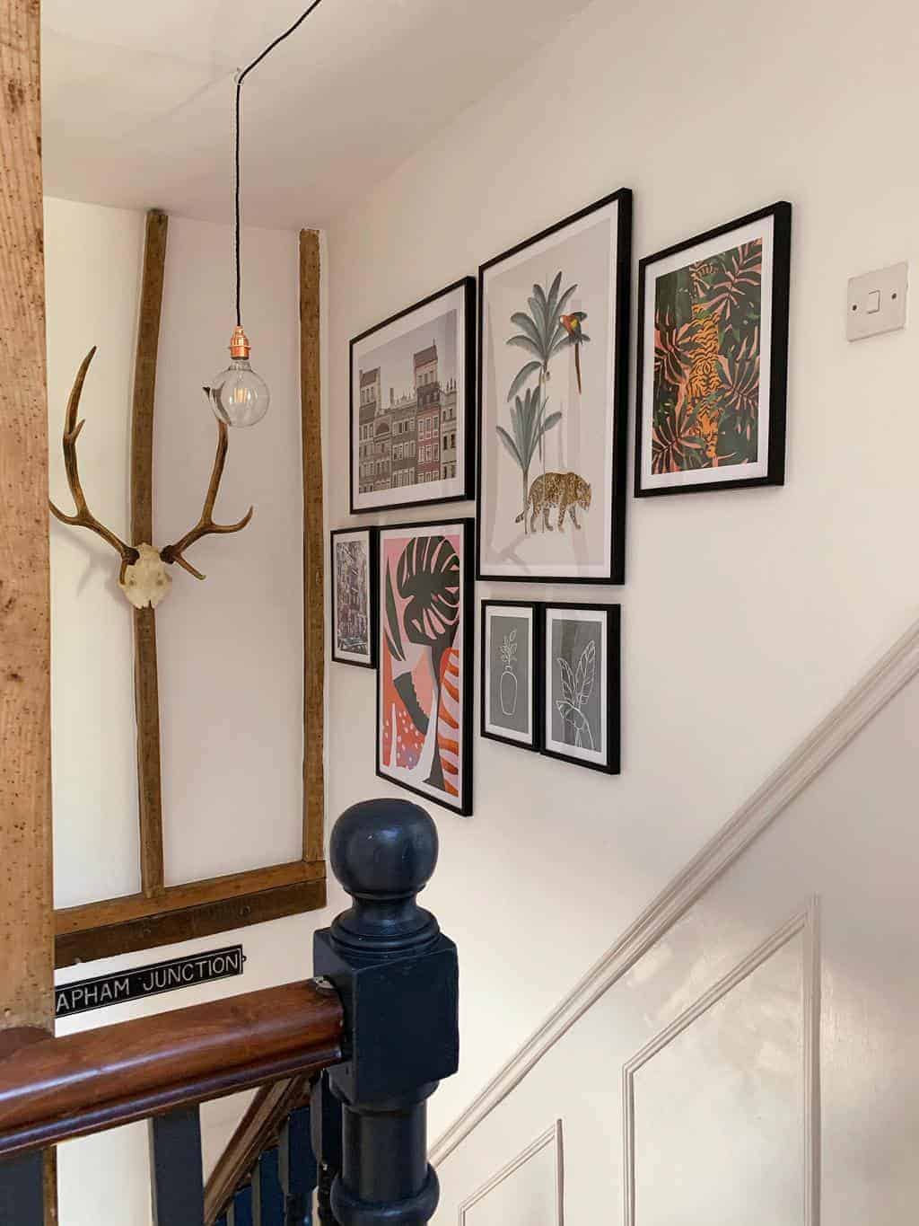 We've updated our stairwell using faux panelling and created a gallery wall