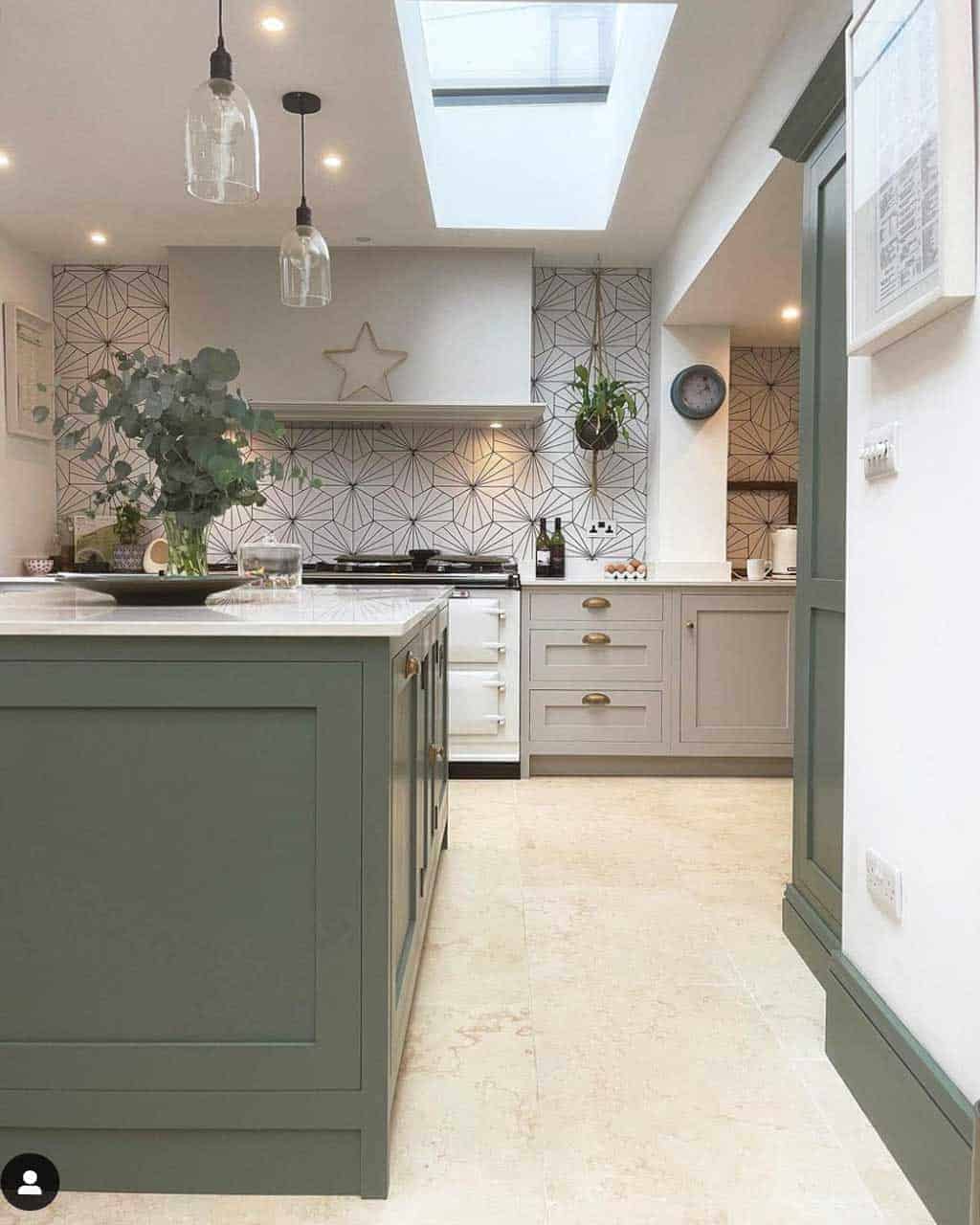 grey and green shaker kitchen with white aga