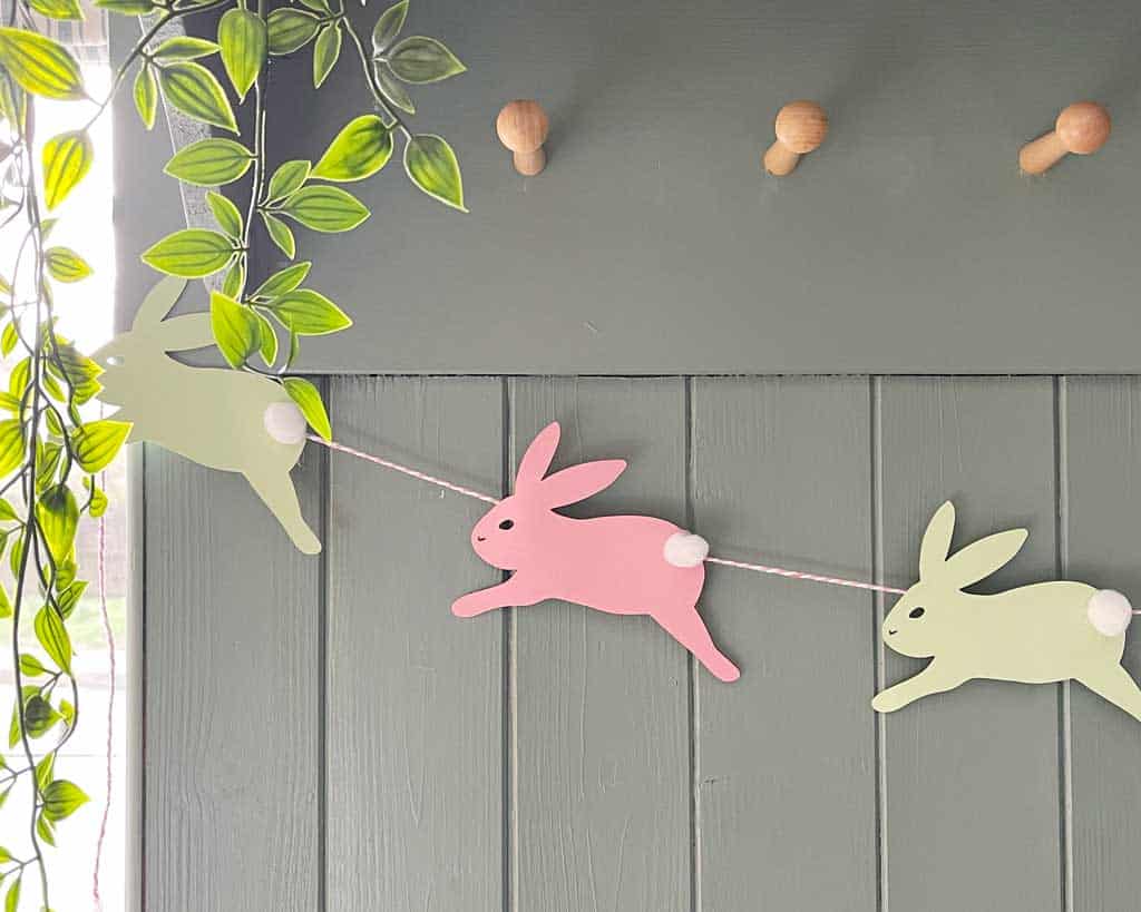 A Simple DIY Easter Bunny Garland With Pom Pom Tails
