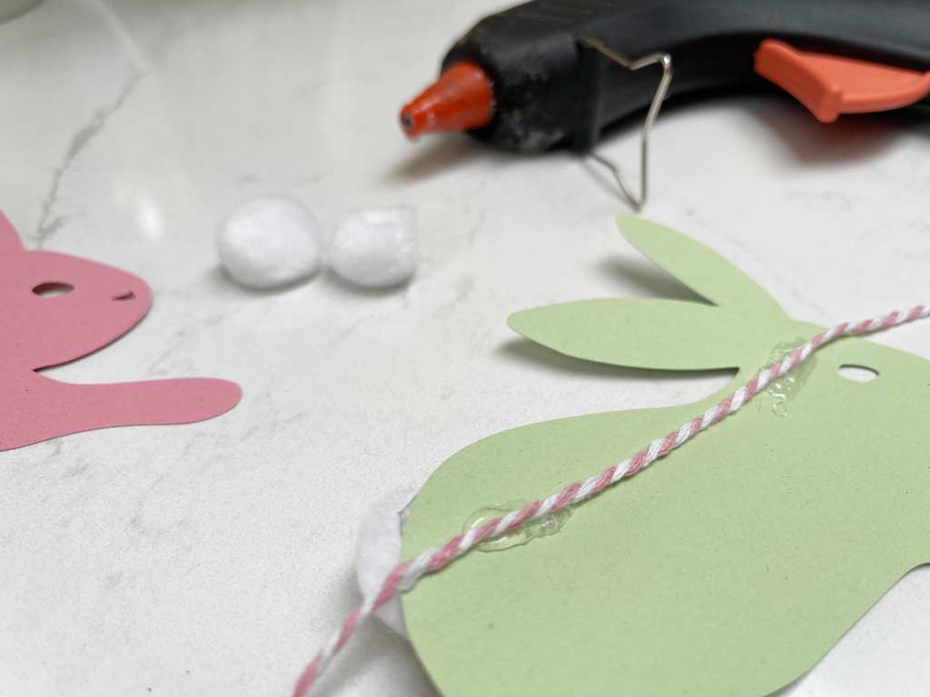 Cut the Free Bunny PNG File out of coloured card to create an easter garland.