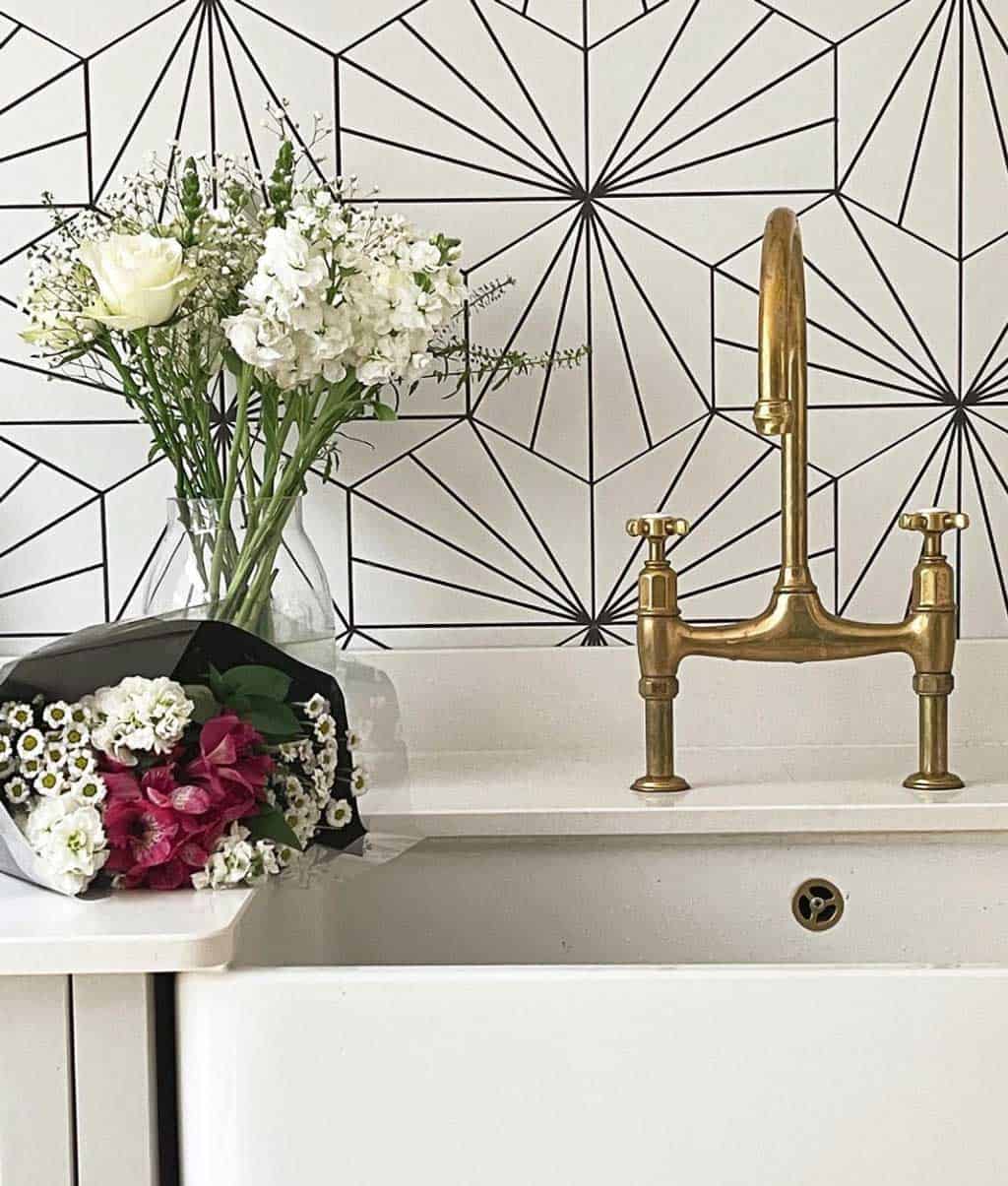 Lilypad tile splashback and aged brass Perrin and Rowe taps