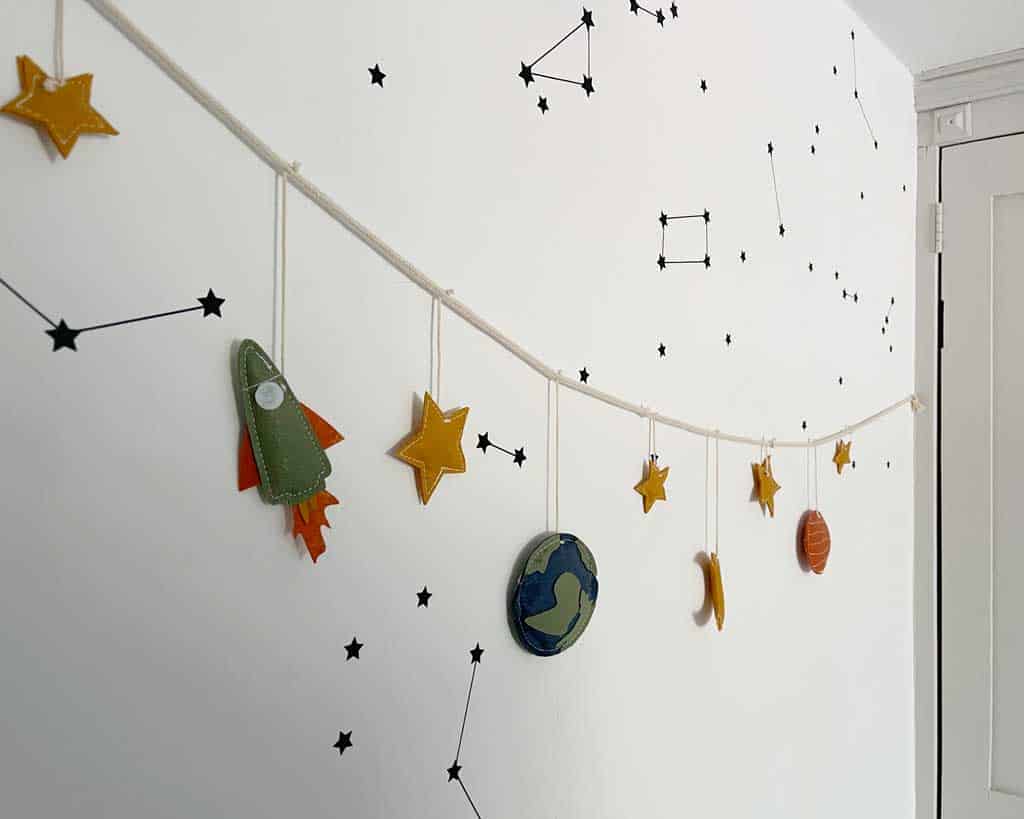 You can get themed space bedroom decor from all sorts of places — Etsy is always a good option for a space kids room