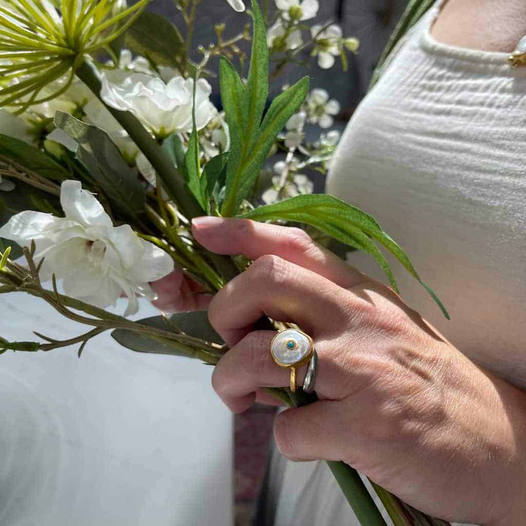 Faux flowers that look real mixed with fresh flowers are a great way of creating large, inexpensive, floral arrangements 