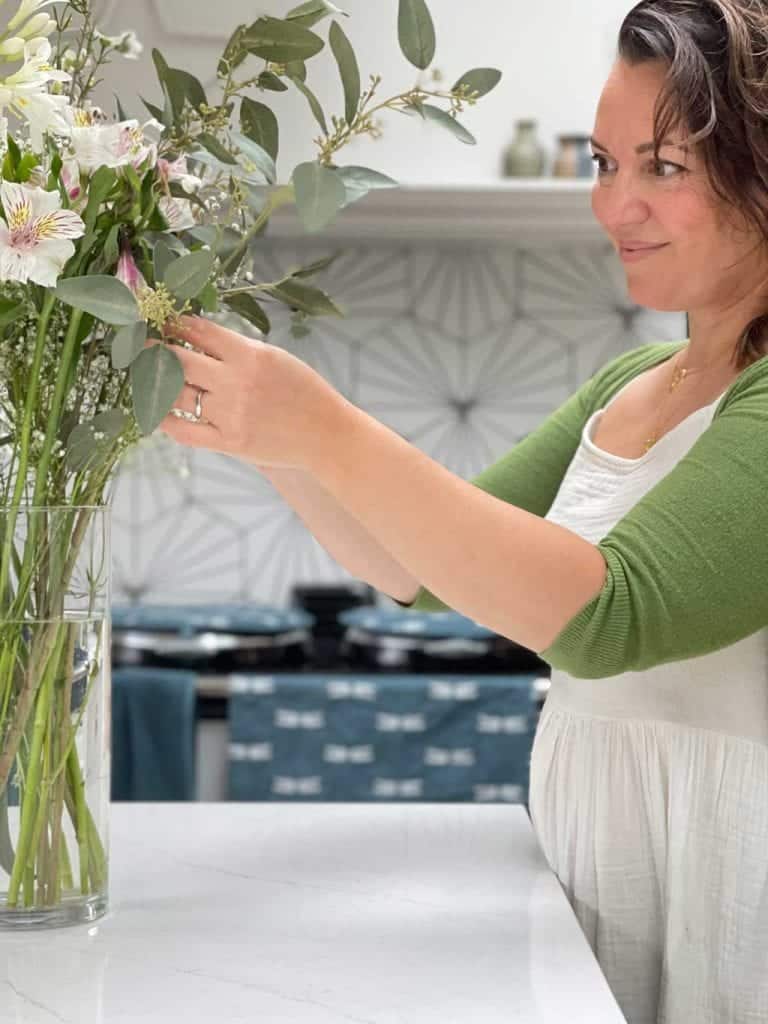 Faux flowers that look real mixed with fresh flowers are a great way of creating large, inexpensive, floral arrangements 