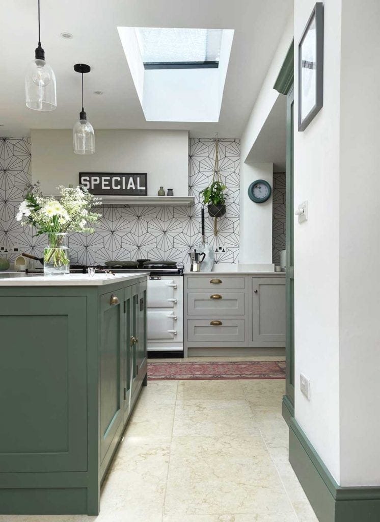 Green and grey kitchen in The Listed Home — with Monte Carlo limestone floor from Quorn Stone