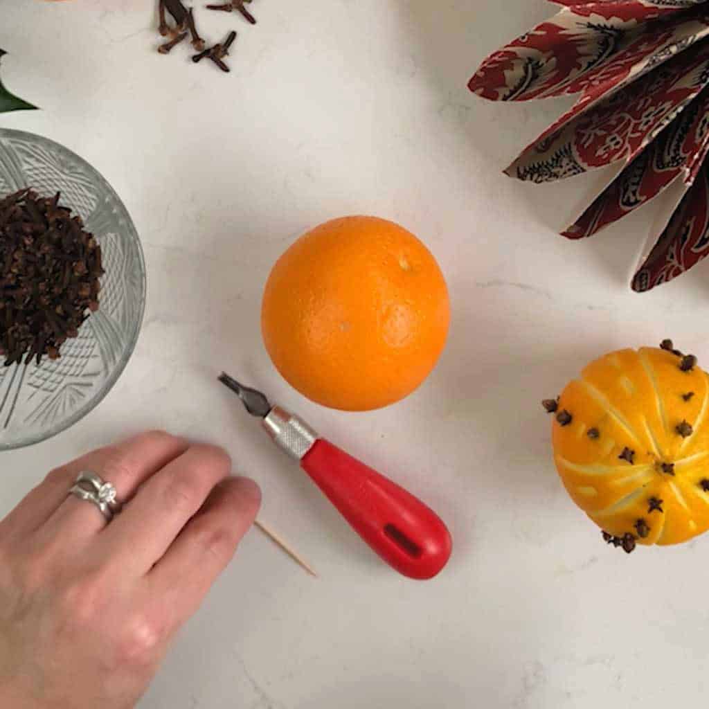 DIY tutorial showing how to make a Spiced Orange Pomander for the festive season.