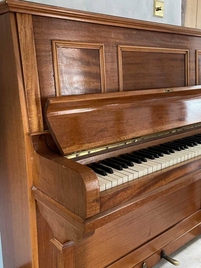 Piano before its piano makeover! See my tutorial —  'How to paint a piano in just 3 easy steps' — to see the piano once it was painted.