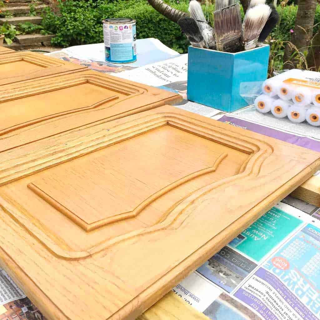 Using furniture paint to paint caravan cupboards.