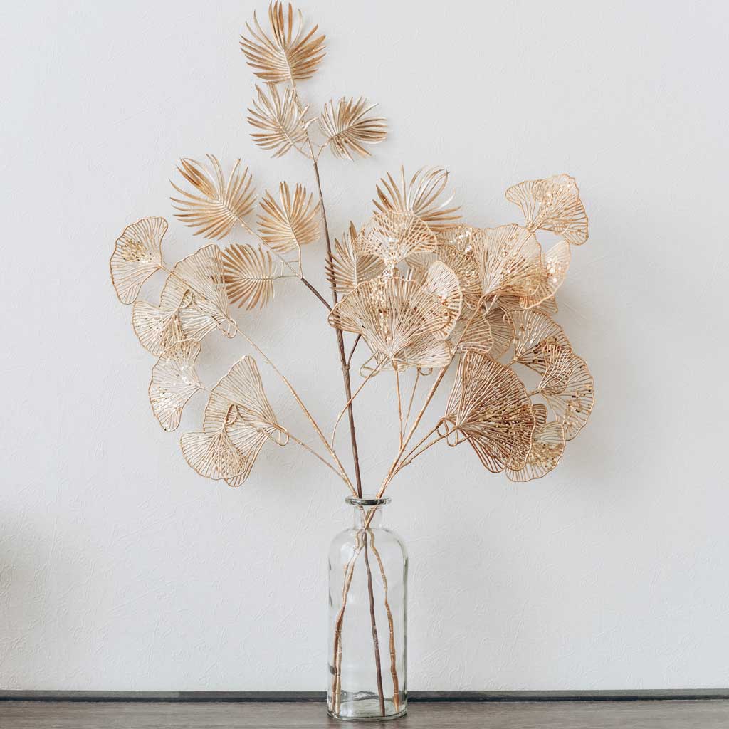 Vases with finds from nature make great cheap home decor. Photo credit: Mikhail Nilov.