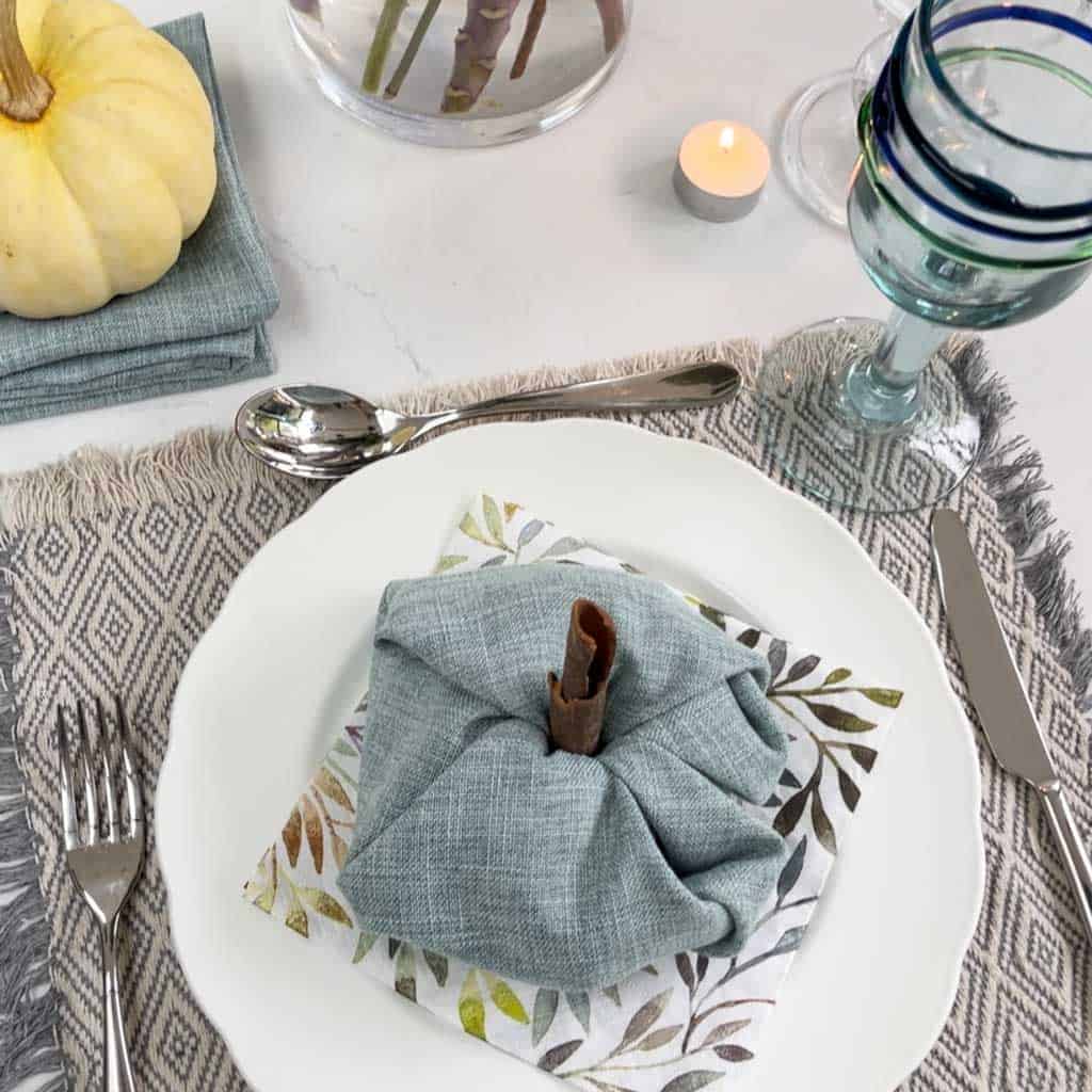 A pumpkin folded napkin is a great fall decor idea