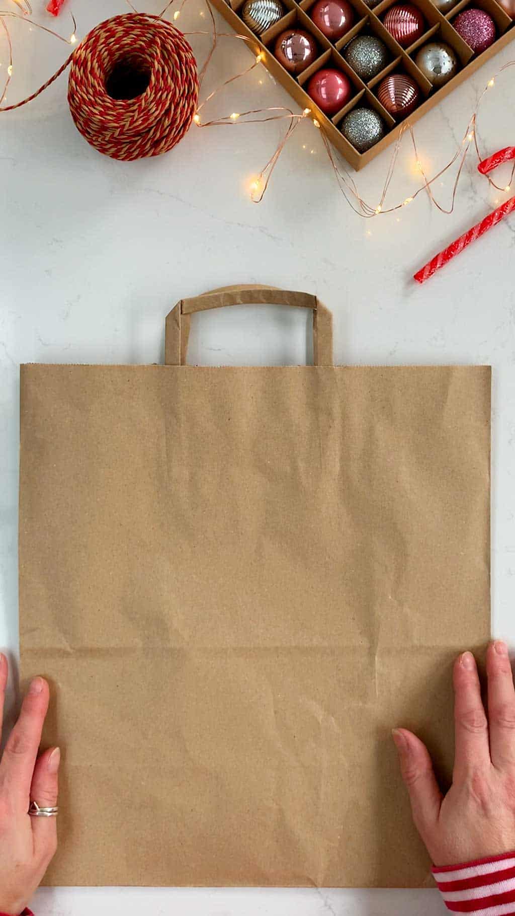 Make a DIY gingerbread house Christmas gift bag.