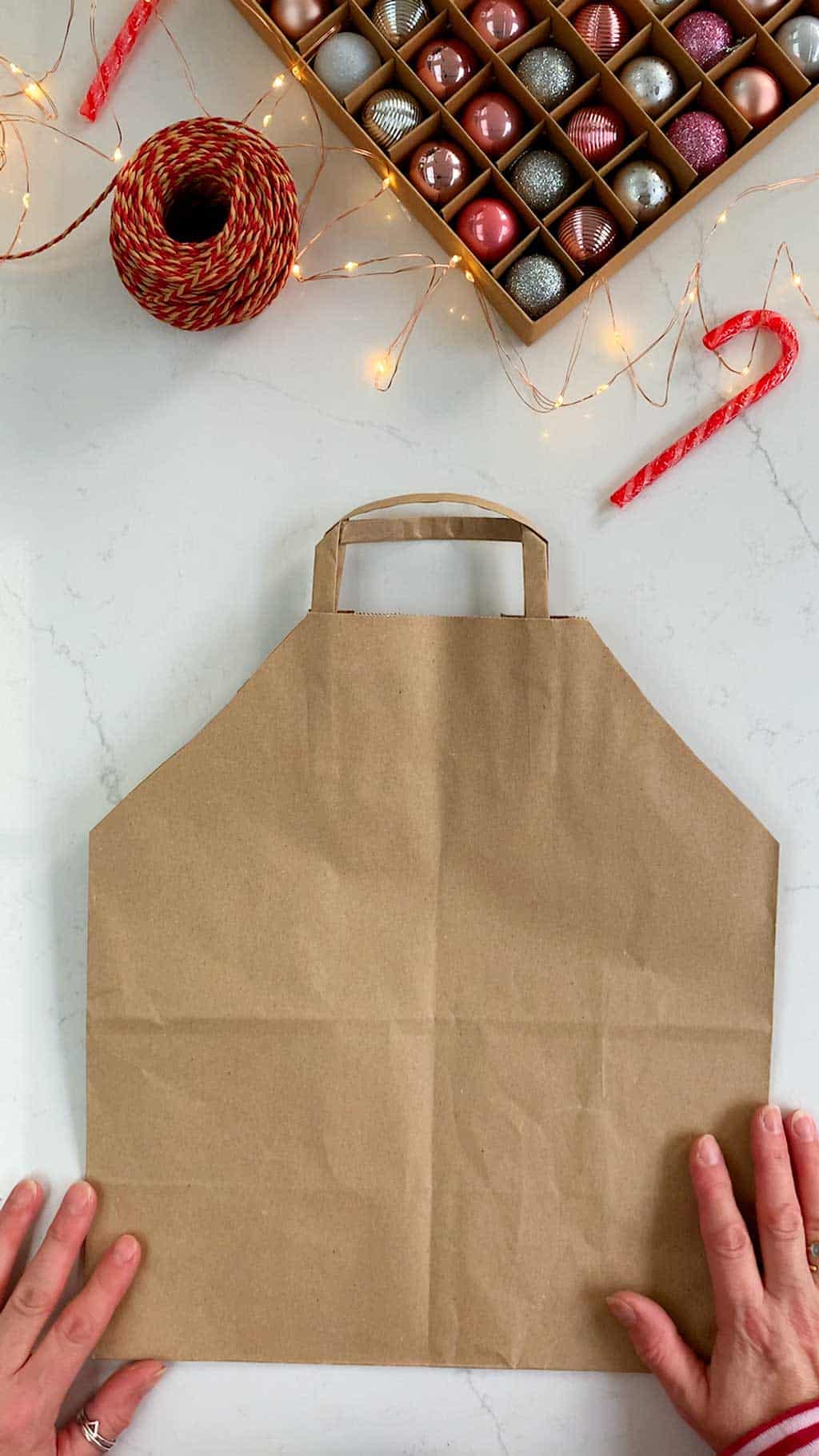 Make a DIY gingerbread house Christmas gift bag.