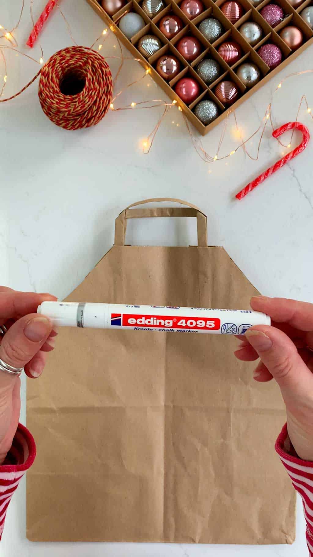 Make a DIY gingerbread house Christmas gift bag.
