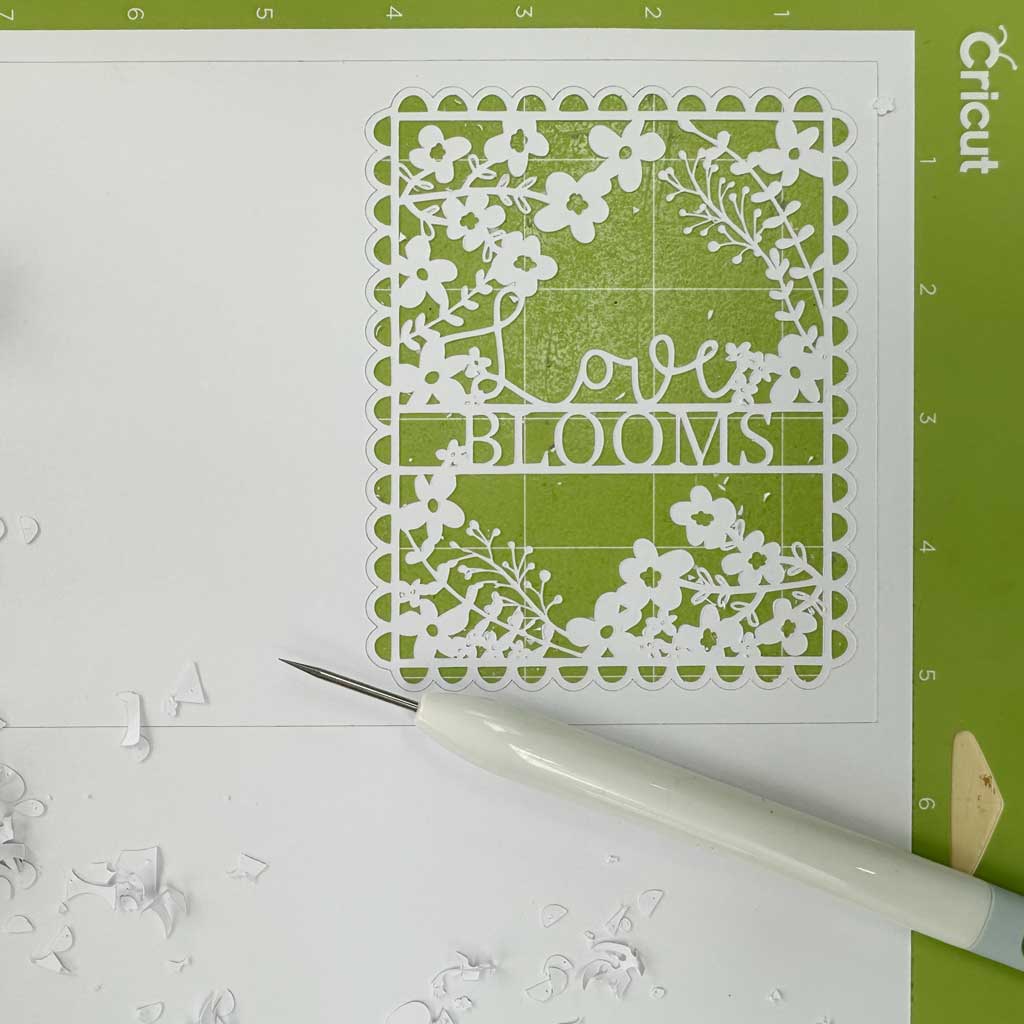 If you're looking for a sweet and thoughtful gift to make for Valentine's Day, why not have a go at creating this 'Love Blooms' papercut using the papercut template I designed? The free Valentine SVG and PNG files are simple to download. 