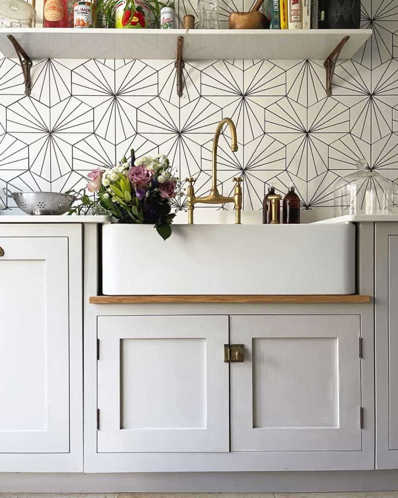 Kitchen decor in The Listed Home — an open shelf over a Butler's sink.