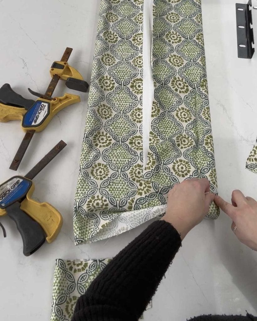 6. How to Upholster a Headboard: Then, carefully fold the fabric over and hold it in place with a clamp until the glue dries.
