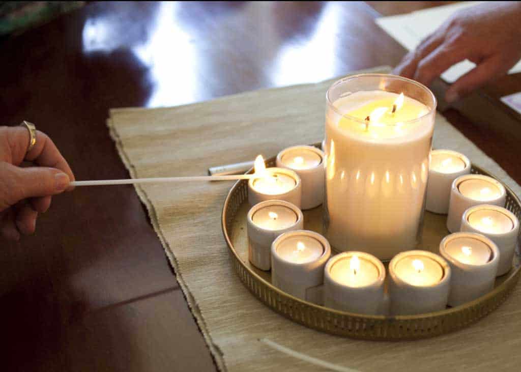 Candle lighting at the twins naming day ceremony.