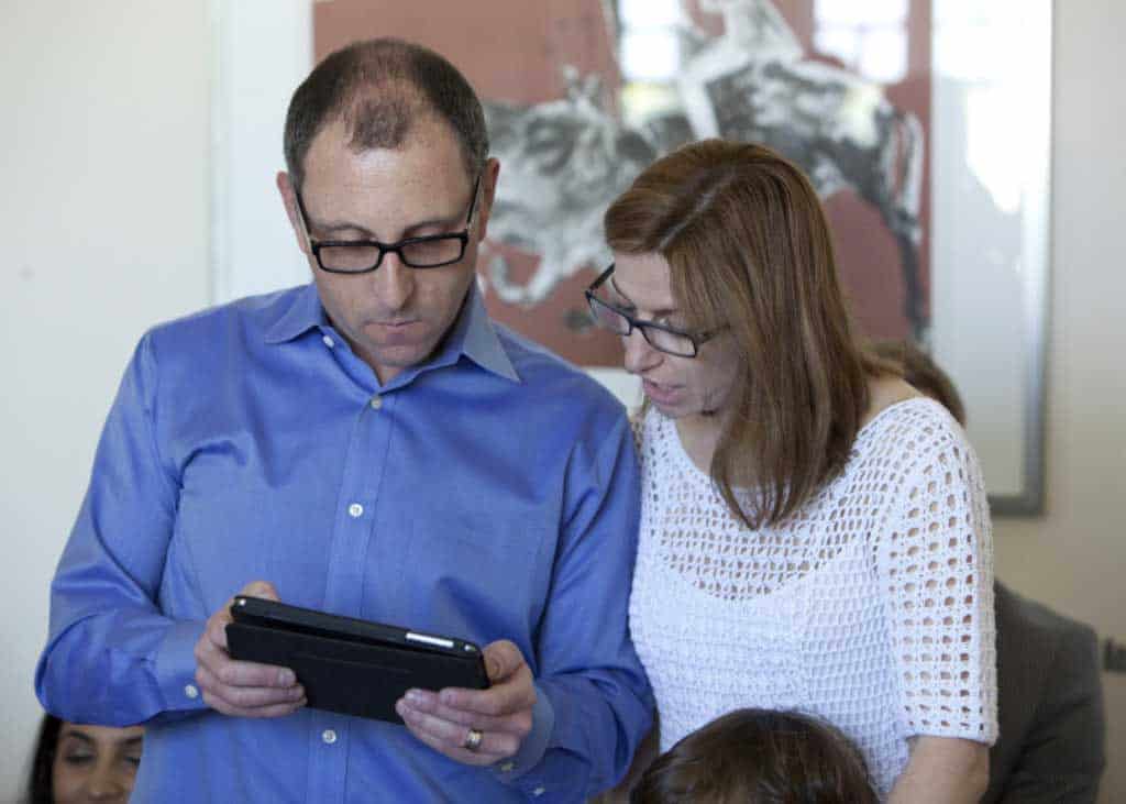 Guide parents reading from The Prophet by Khalil Gibran at the twins naming ceremony.