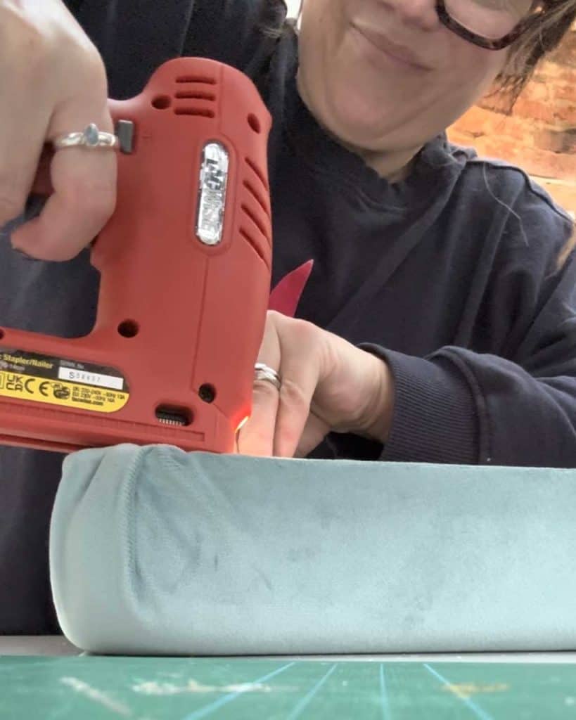 Rush Chair Seat Replacement DIY Tutorial — staple the fabric on to the base.