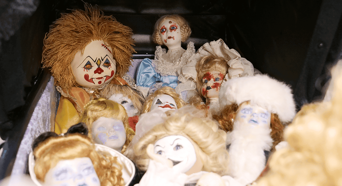 Halloween dolls are being pushed in a stroller.