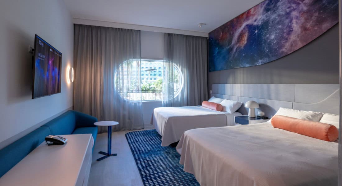 Universal Stella Nova Resort offers 750 double-queen guest rooms that sleep up to four guests and feature spaceship-styled windows. (Photo: ©Universal Orlando Resort)