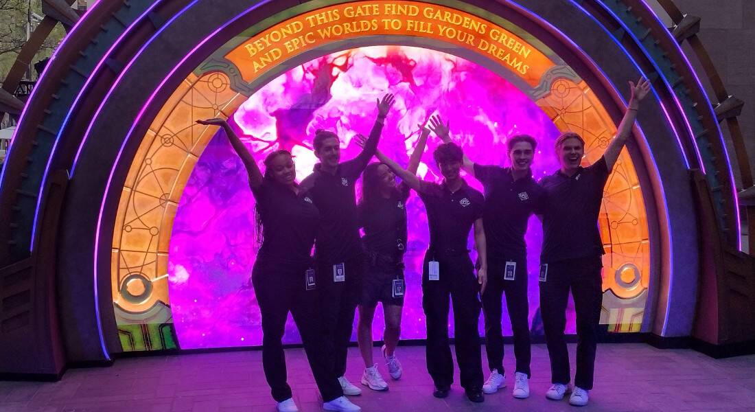 Members of the Epic Universe Portal Tour pose in front of the portal. (picture by Spencer Bollettieri)