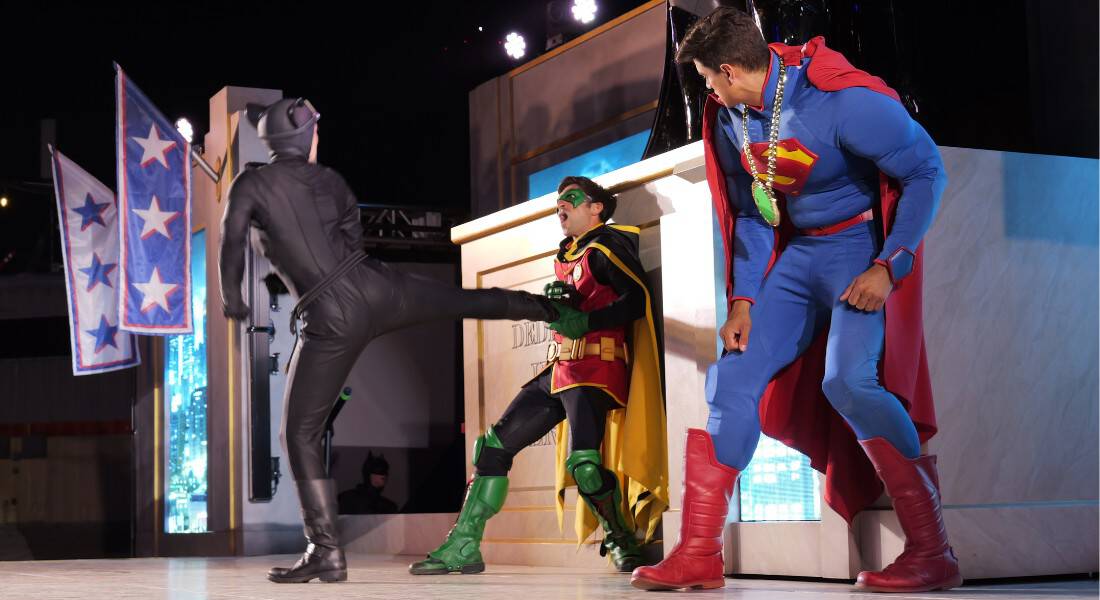 Catwoman pins Robin against the base of Batman's statue. Superman can't intervene because of Kryptonite hanging from his neck. (photo by Joe Tracy for Theme Park Magazine)