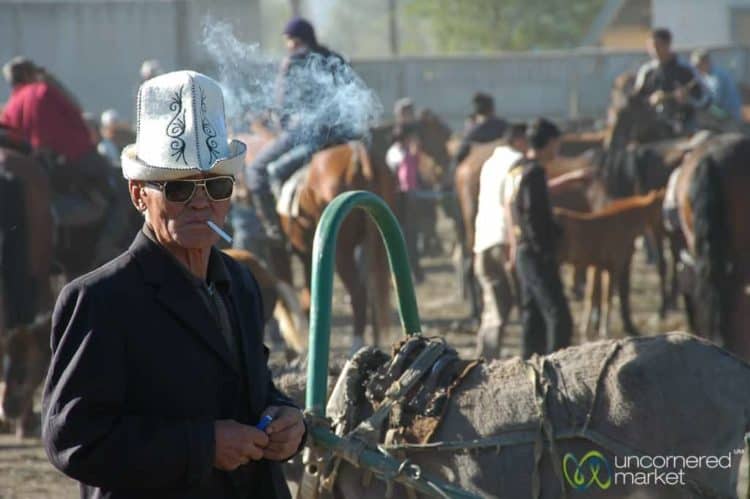 Old Kyrgyz Man with Kalpak, Smoking - Karakol, Kyrgyzstan