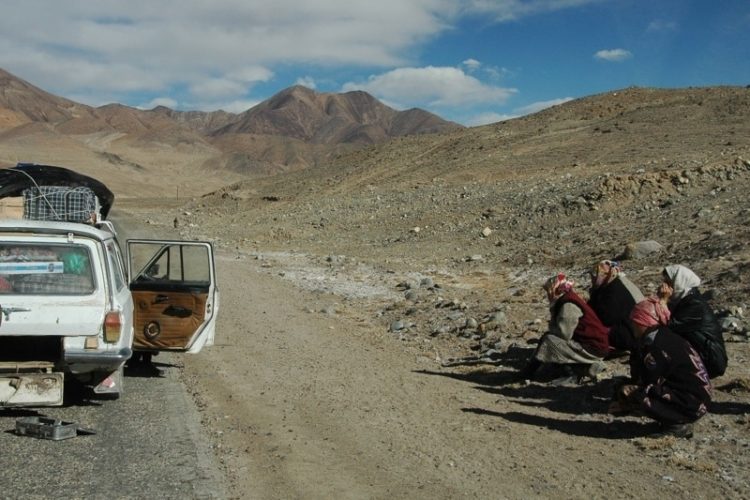 Women Waiting by Broken Down Car - Pamir Mountains, Tajikistan