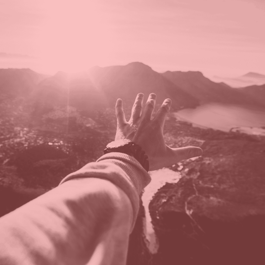 Rejected Merchant Account Application. Hand reaching out to distant mountains.