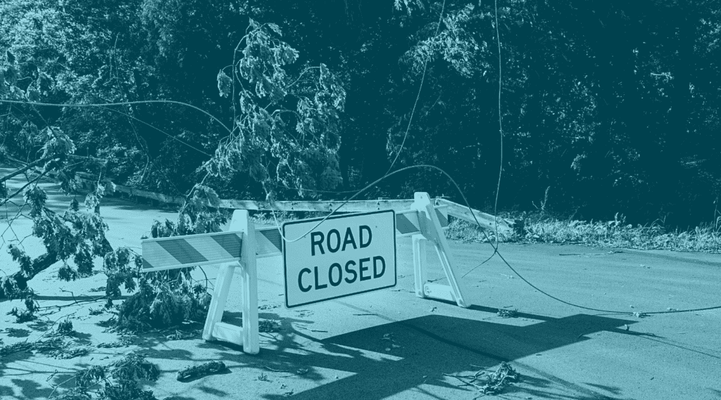 Issuer decline post with conceptual image showing Road Closed sign in front of downed tree to indicate obstacles faced in denied credit card purchases