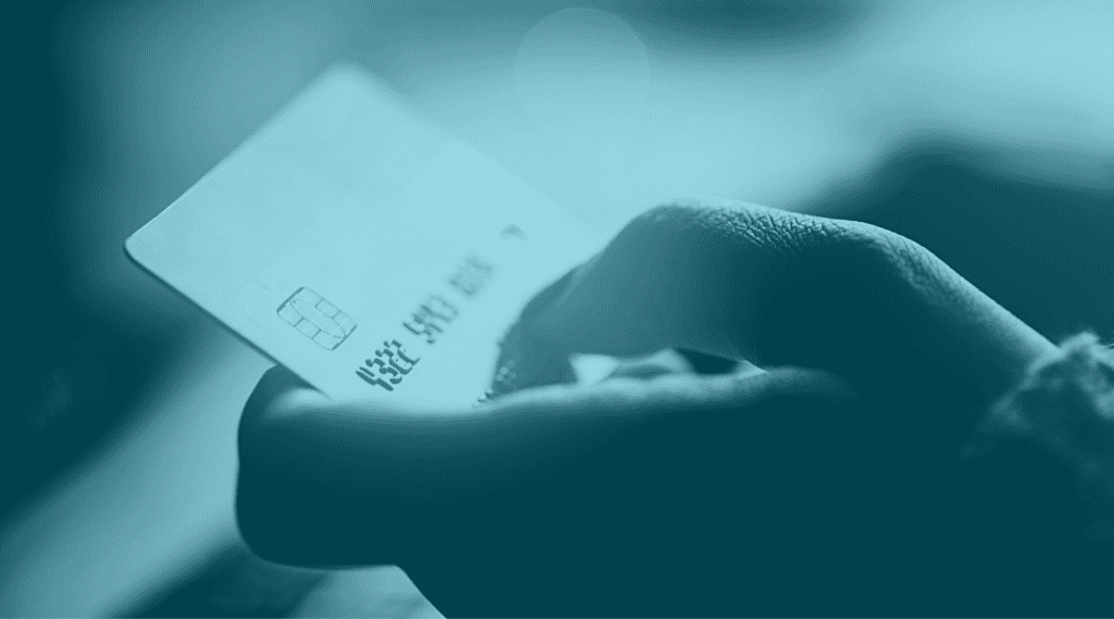 Hand holding credit card. Related to issuer declines of online purchases