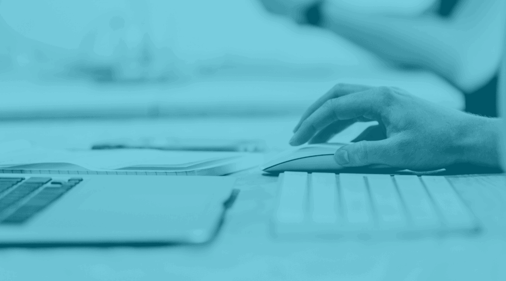 Hand shown using a computer mouse. Related to tech for platform integration