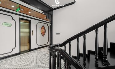 Elegant elevator and staircase interior at ViettrendTour cruise, luxury travel experience.