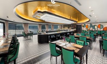 Luxurious cruise restaurant with elegant decor and panoramic water views.